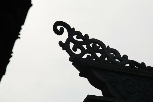 Black sculpture against the sky