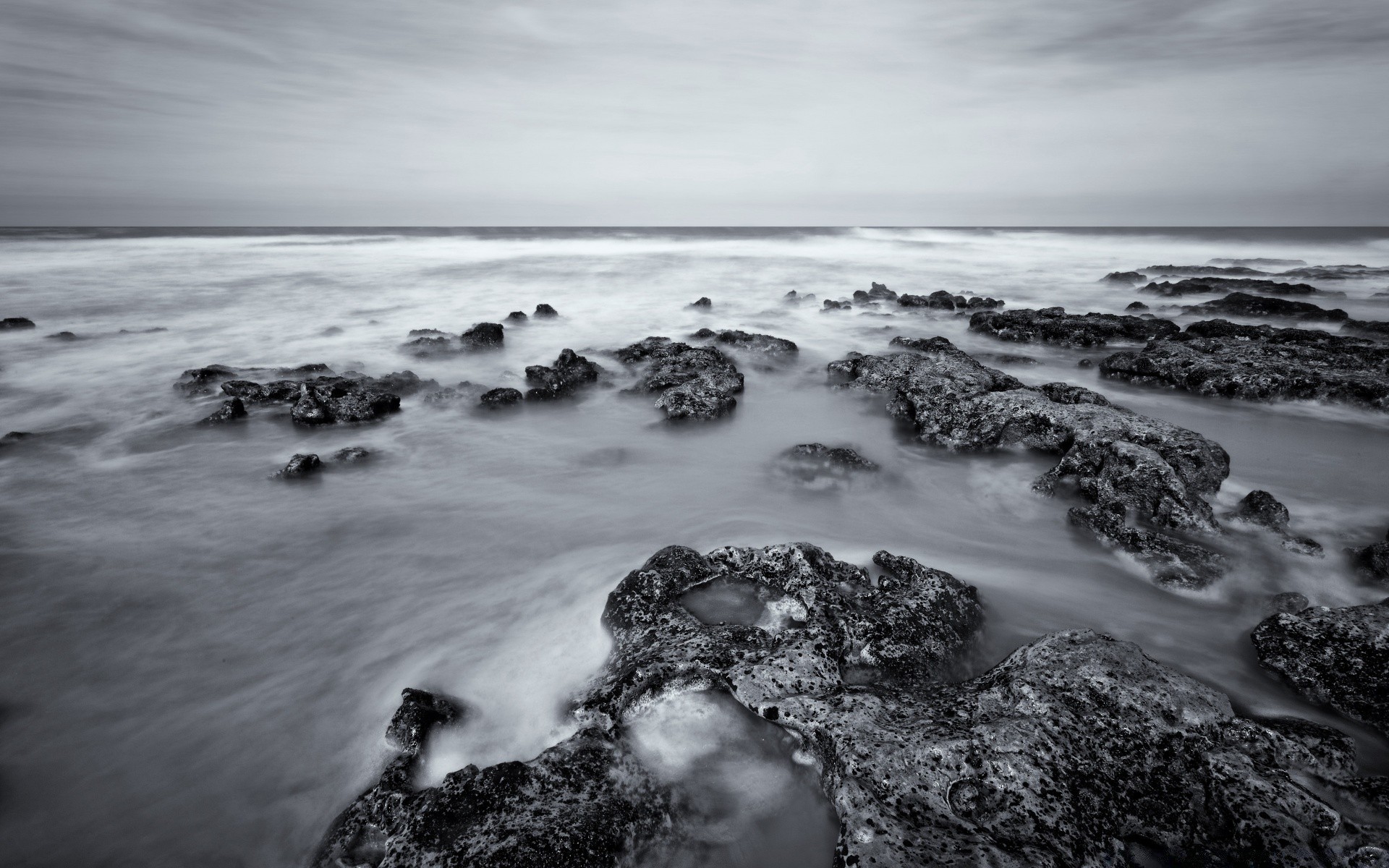 black and white water beach ocean sea seashore landscape seascape sunset rock sand surf sky travel tide shore evening nature dawn wave