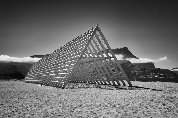 A chic black and white beach on the background of mountains