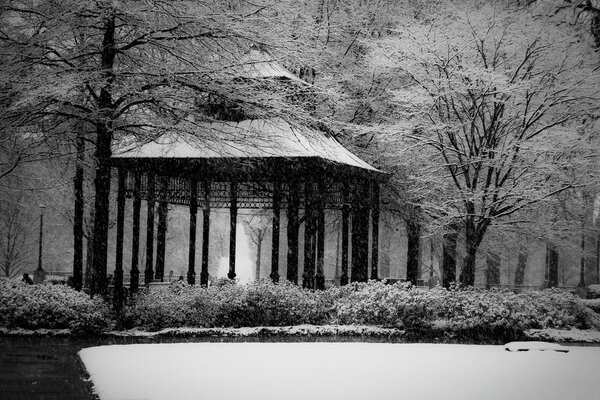 A gloomy gazebo in a snowy park