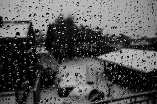 Raindrops on the glass. Sadness