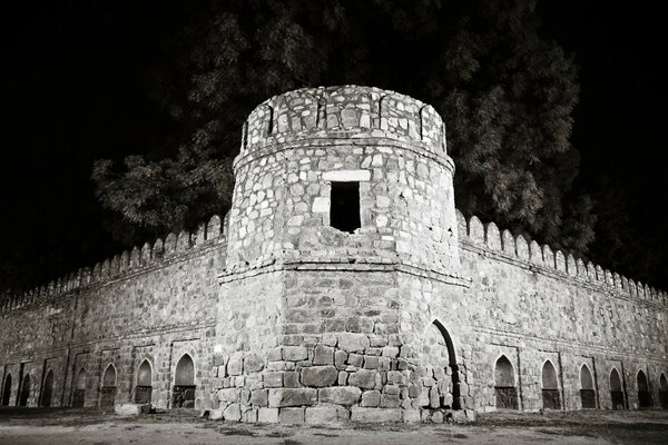 Black and white image of an ancient castle