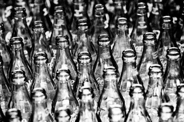 Black and white image of bottle polka dots