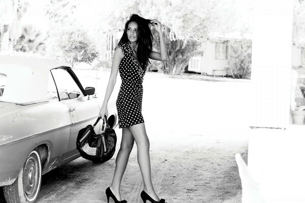 Girl model on a coupe with a folding roof