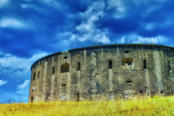 Round castle on the sky background