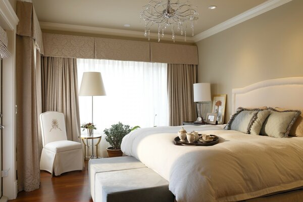 The interior of the bedroom in beige tones