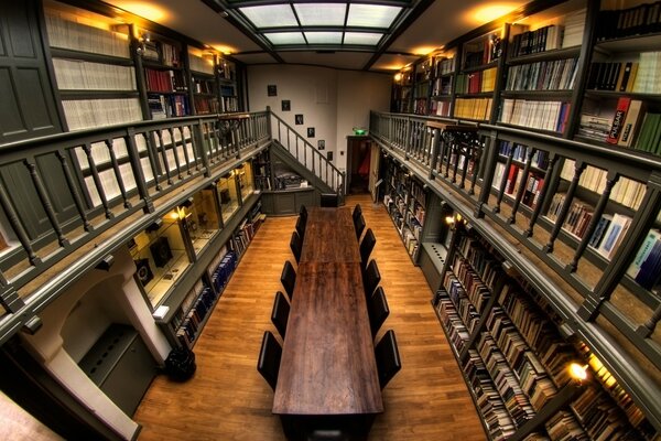 A large library and a table in the middle