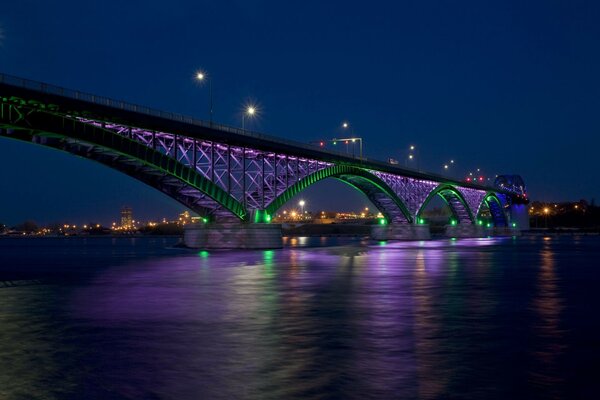 Bridges illuminated and the water surface in the night