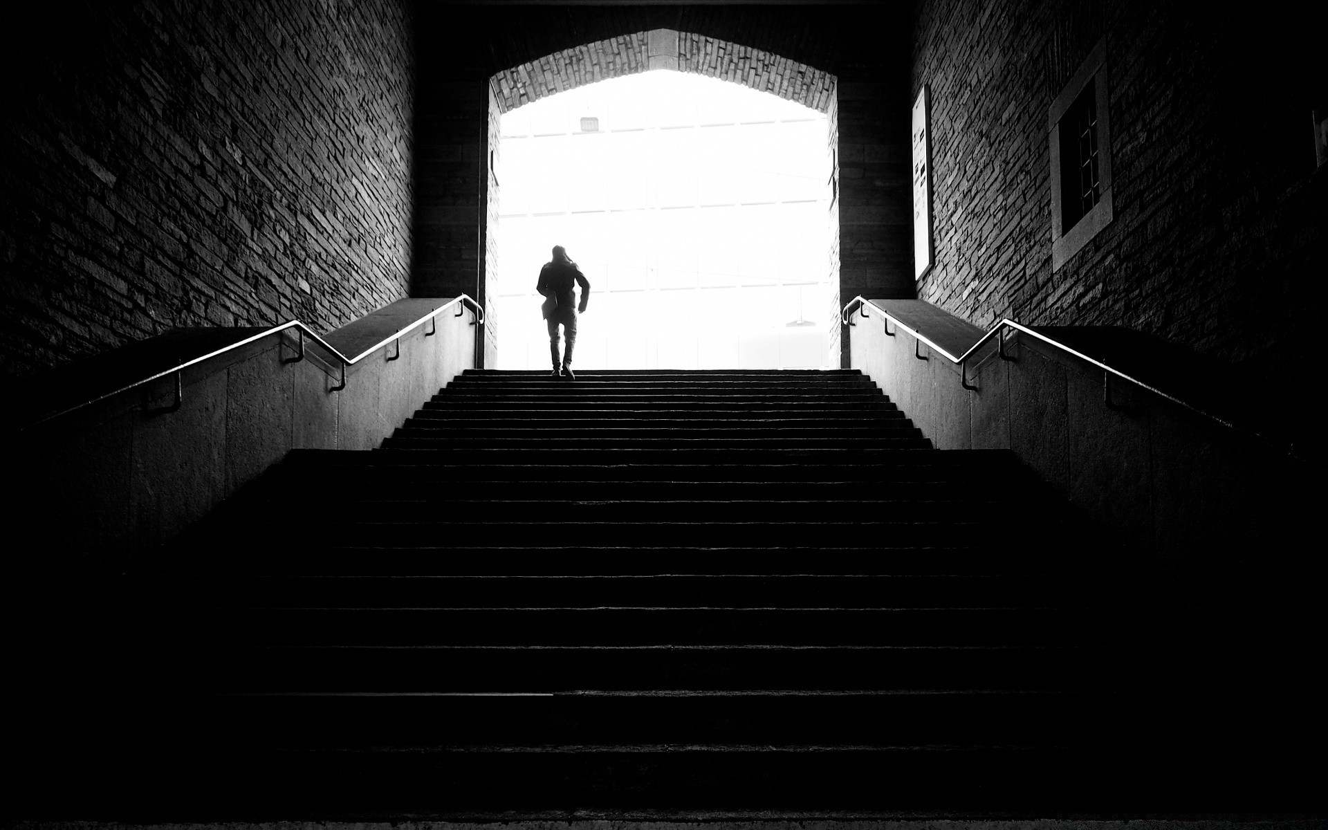 black and white monochrome step wall dark light architecture indoors shadow inside urban street old tube building city