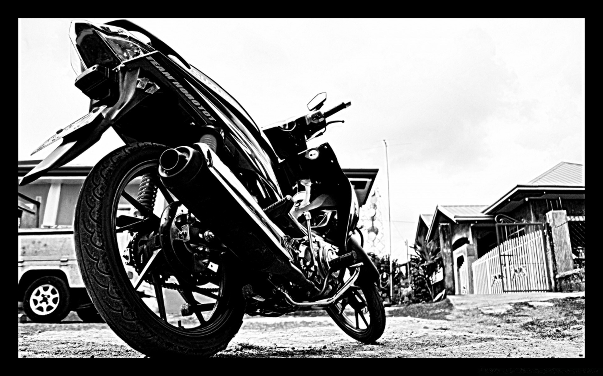 Black and white photo of a motorcycle taken from below wallpaper