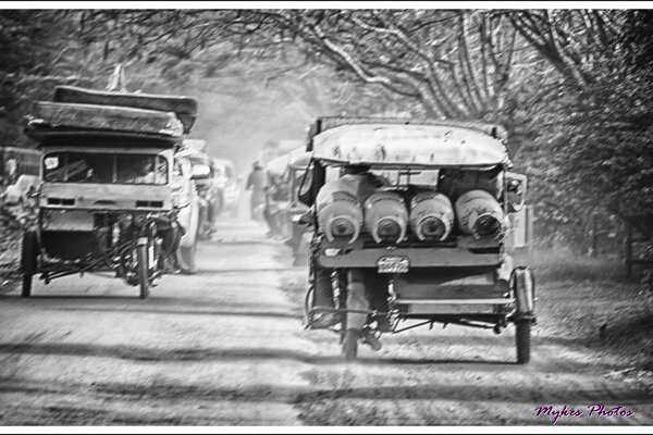 Black and white photo of expensive with cars