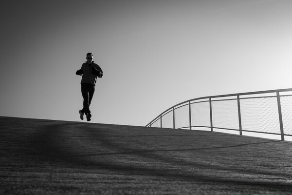 Monochrome photo of a running man