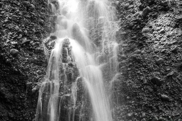 Black and white waterfall in the mountains