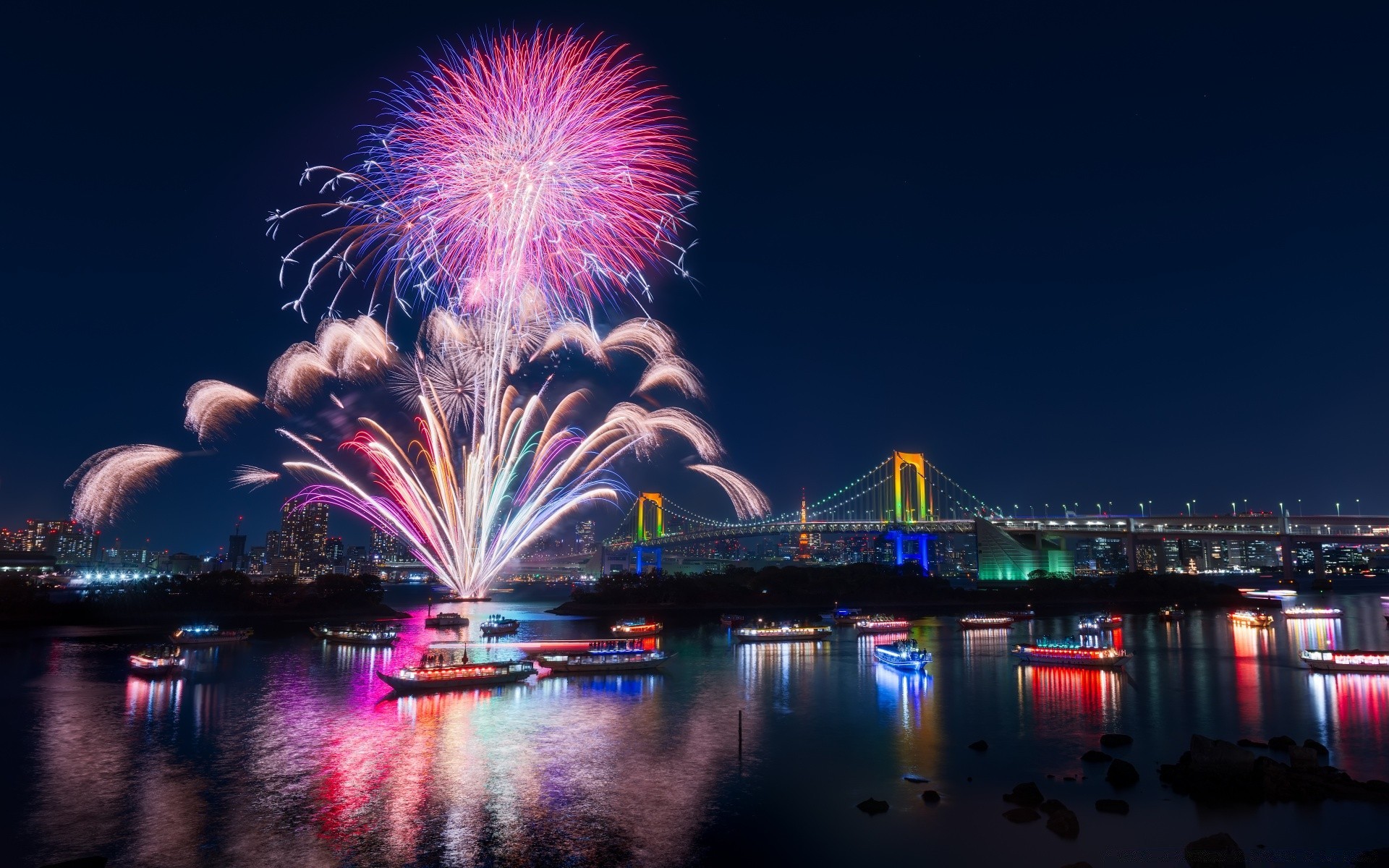 other city city festival bridge evening architecture building river water light travel sky urban fireworks dusk cityscape