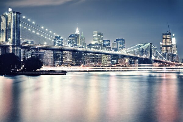 The bridge on the background of skyscrapers unreal light