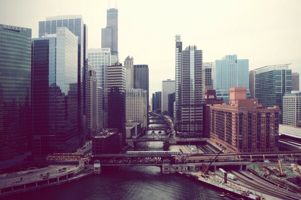 TRAIN ON THE BACKGROUND OF A BIG CITY