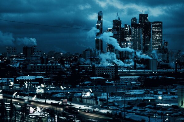 VILLE DE NUIT SUR FOND DE CIEL SOMBRE