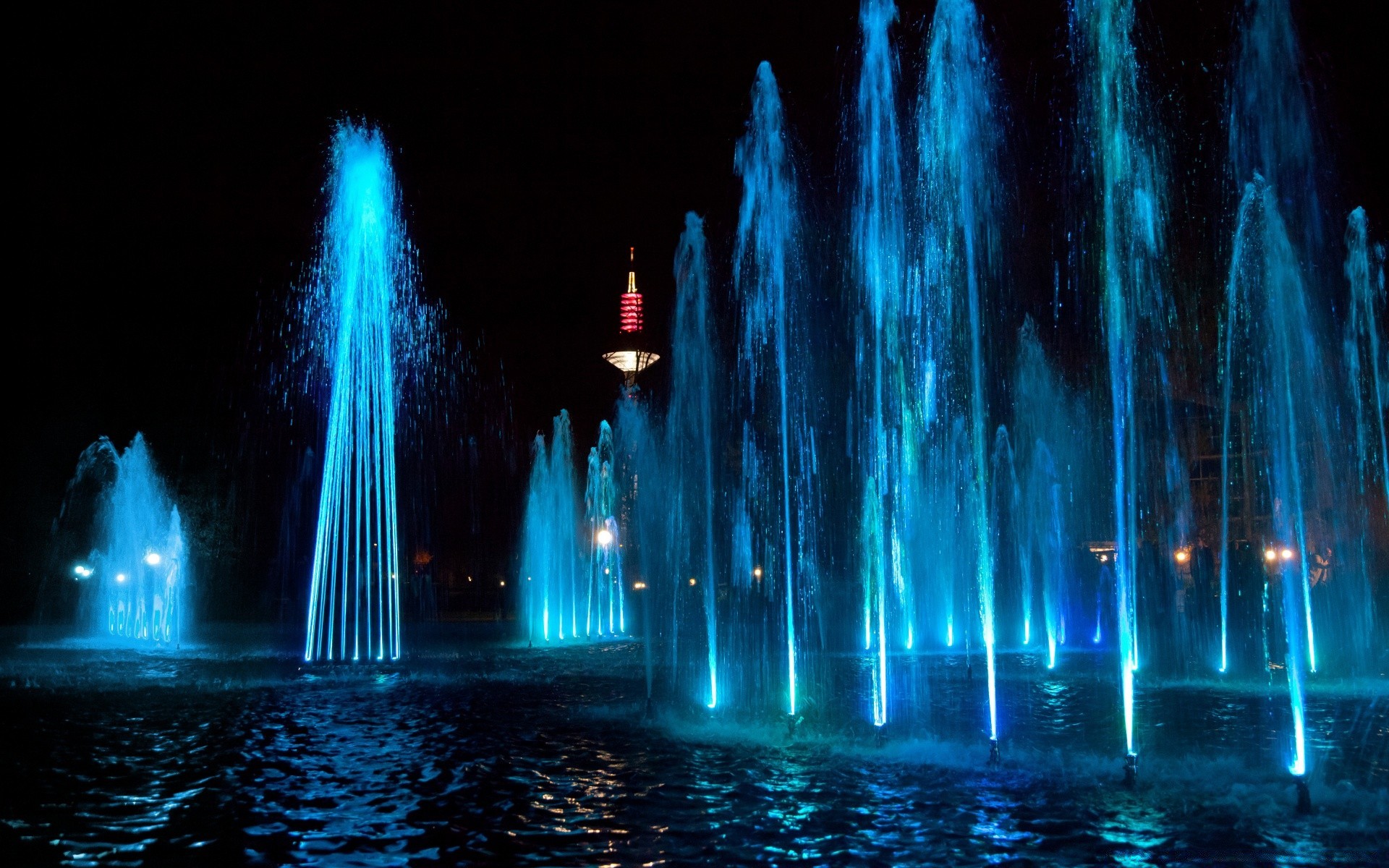 other city water travel illuminated motion sky city evening dark river architecture outdoors fountain light blur reflection