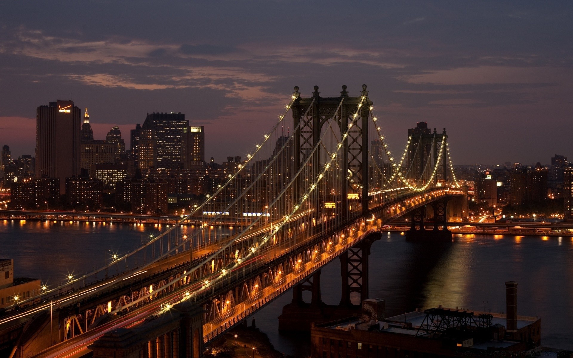 other city bridge river city water architecture travel dusk evening sunset downtown suspension bridge traffic sky urban connection skyline cityscape transportation system building