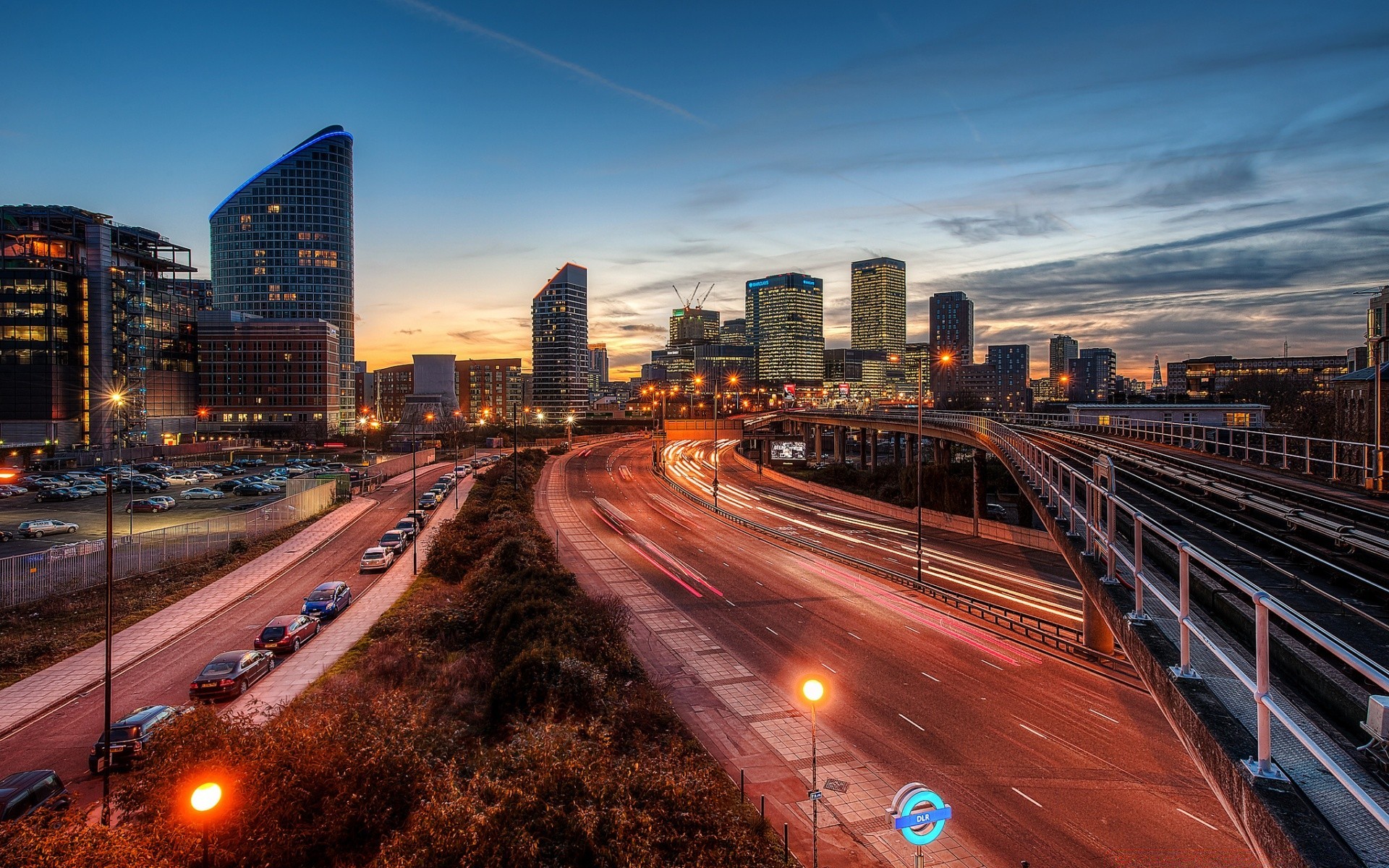 other city traffic downtown road city transportation system highway dusk travel skyscraper car fast architecture evening bridge street blur urban cityscape skyline building