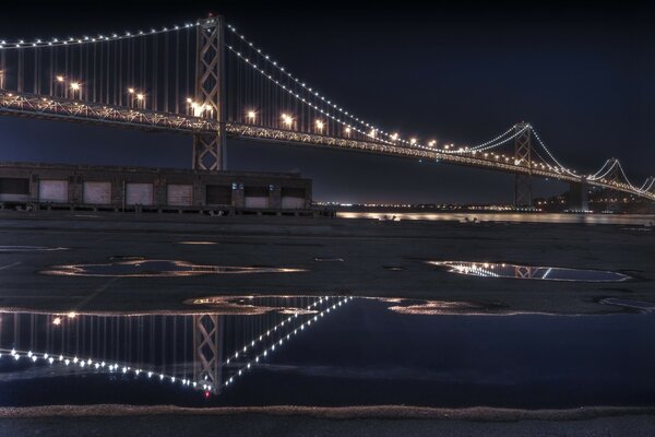 Night photo of a glowing bridge