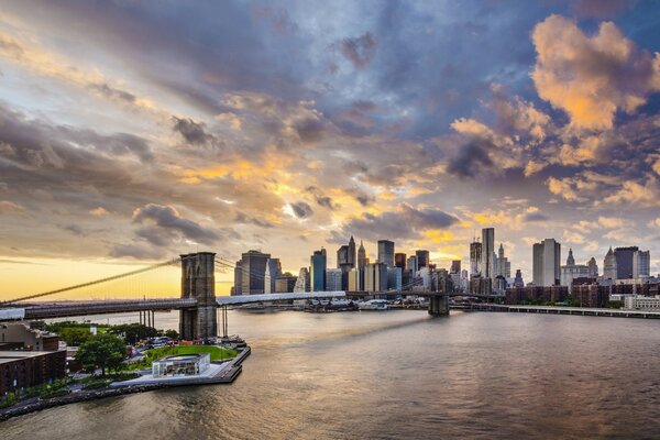 Clouds at sunset over the bridge and the city