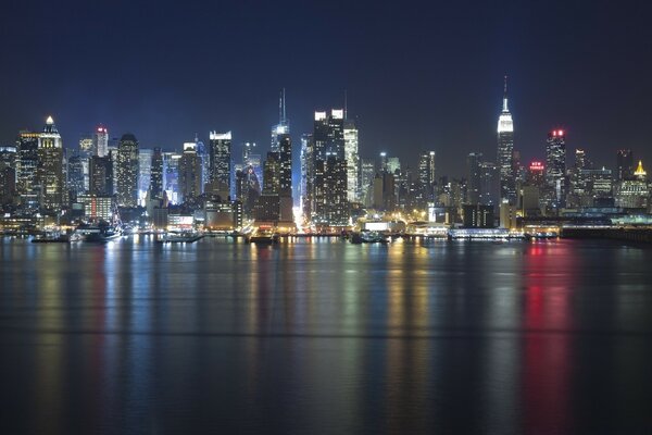 Skyscrapers in the night light on the water