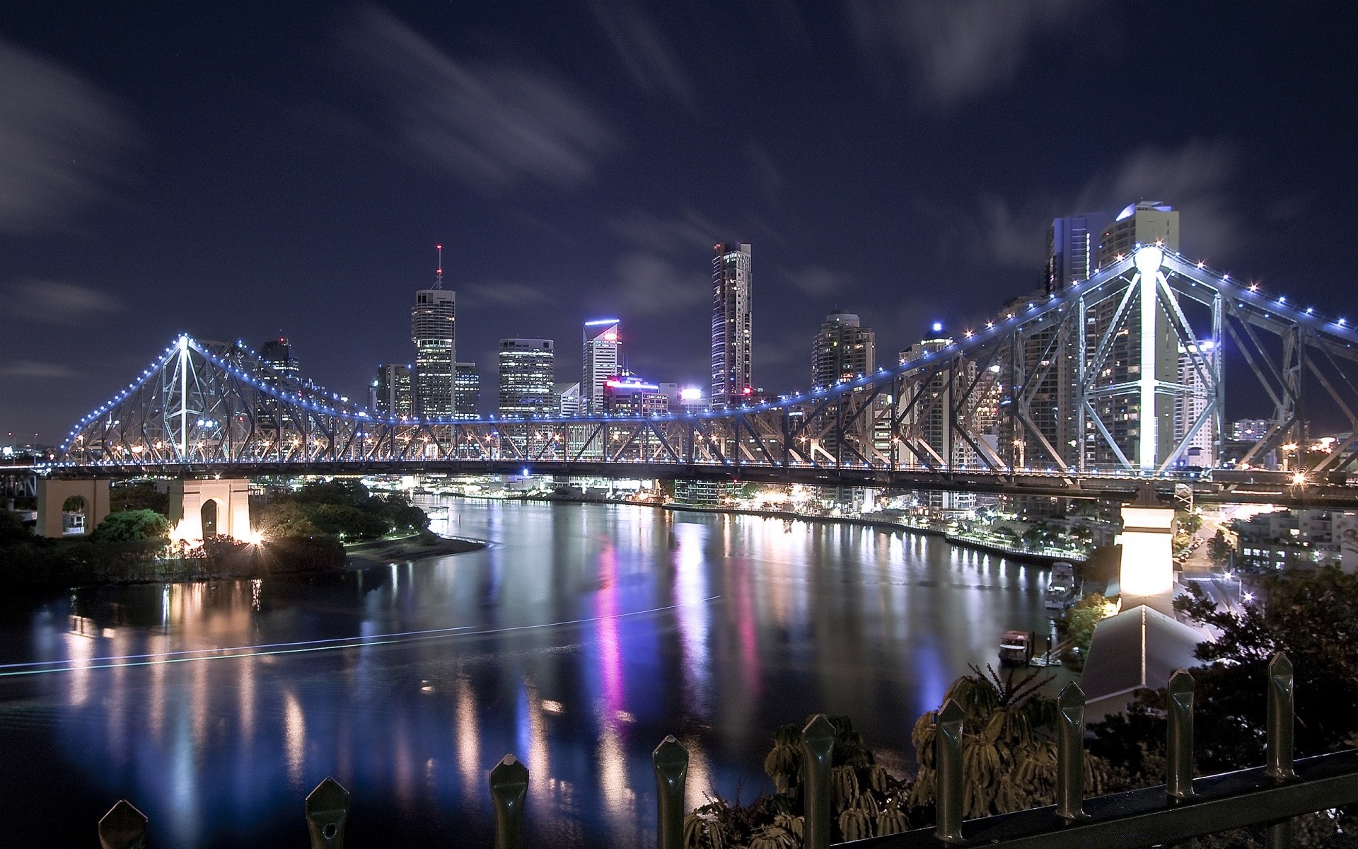 other city bridge river city water architecture travel reflection urban evening sky building dusk sunset light cityscape waterfront downtown skyline