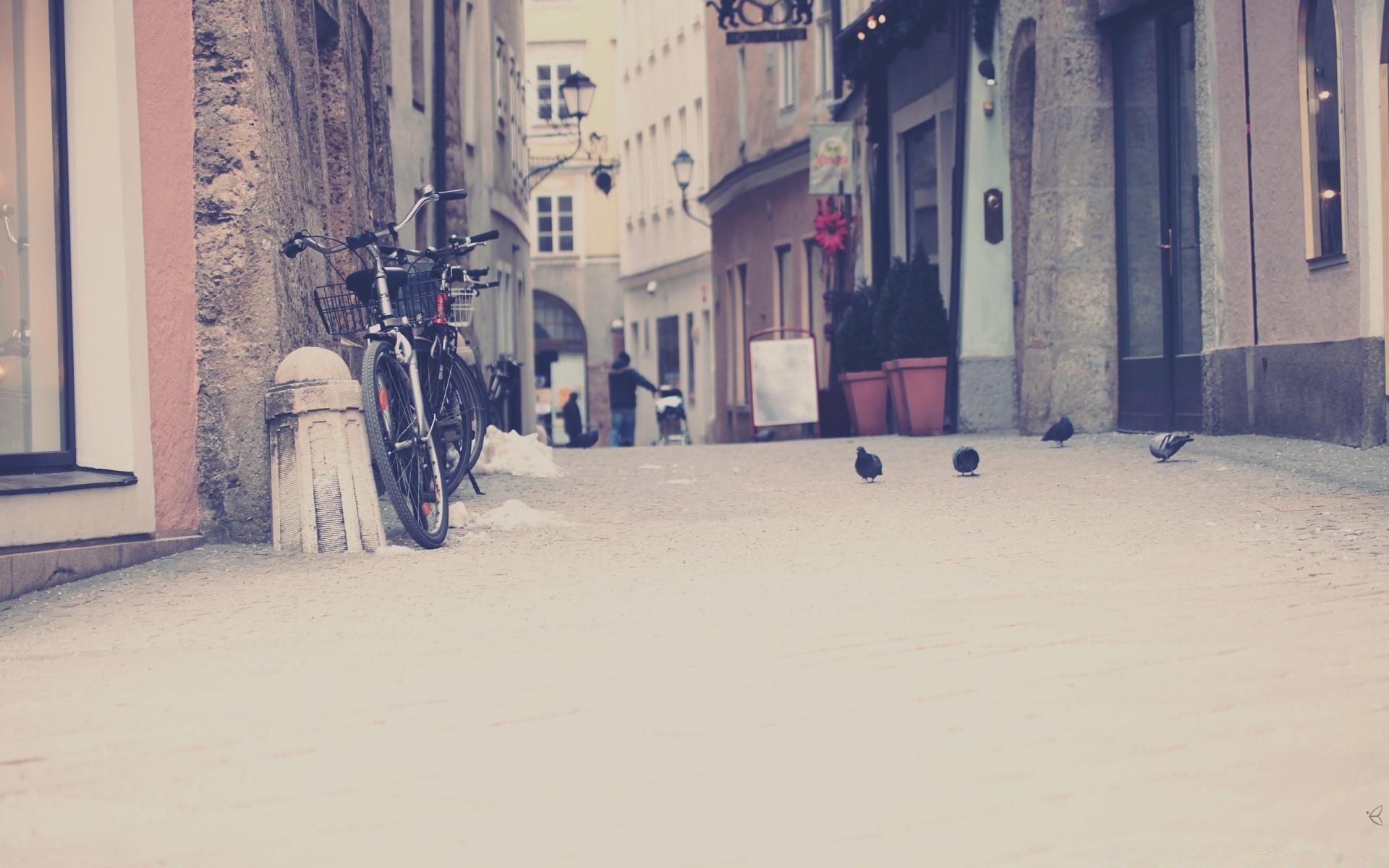 other city street city travel urban architecture town building winter house alley outdoors snow road adult daylight shadow pavement