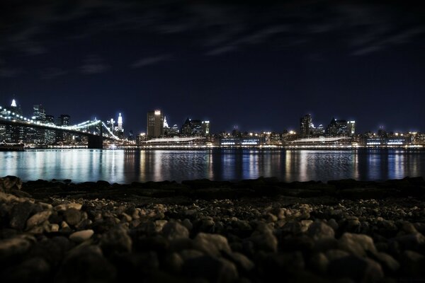 Night city and bridge in the light of lanterns