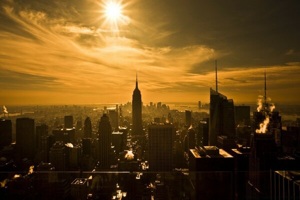 The sun is high above the big city