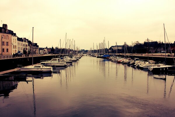 Boats are located on both sides of the river