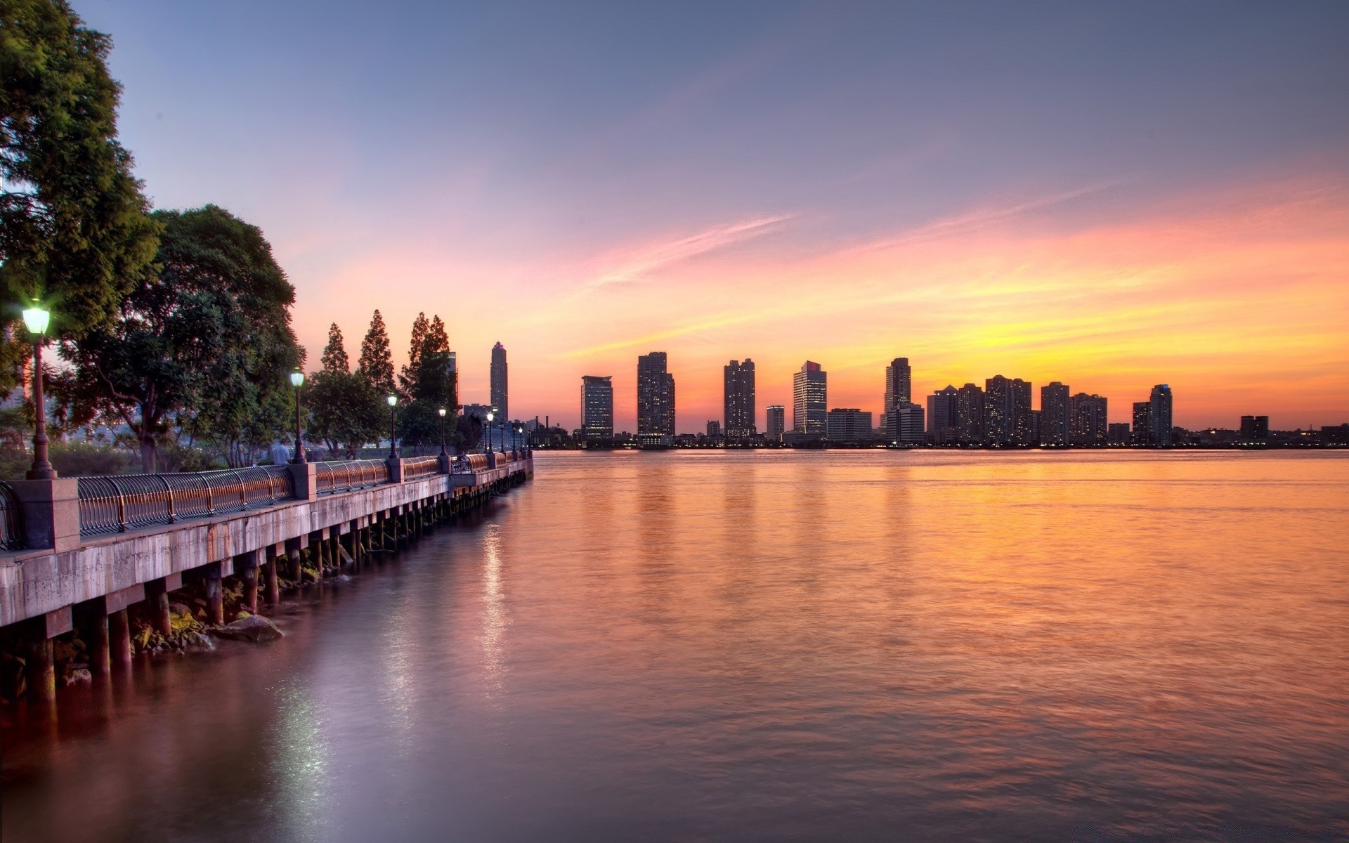 other city sunset water travel dusk evening dawn sky city reflection architecture outdoors river pier