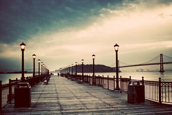 Bridge with lanterns. Beautiful evening landscape