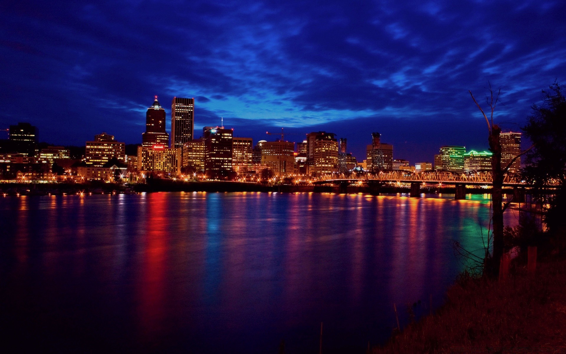 other city city sunset skyline architecture cityscape dusk water reflection travel downtown sky evening river building skyscraper urban waterfront bridge dawn