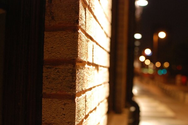 Architecture of another city on a dark background with light in the window