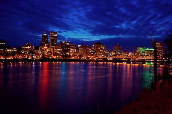 Reflection of the lights of the night city in the water