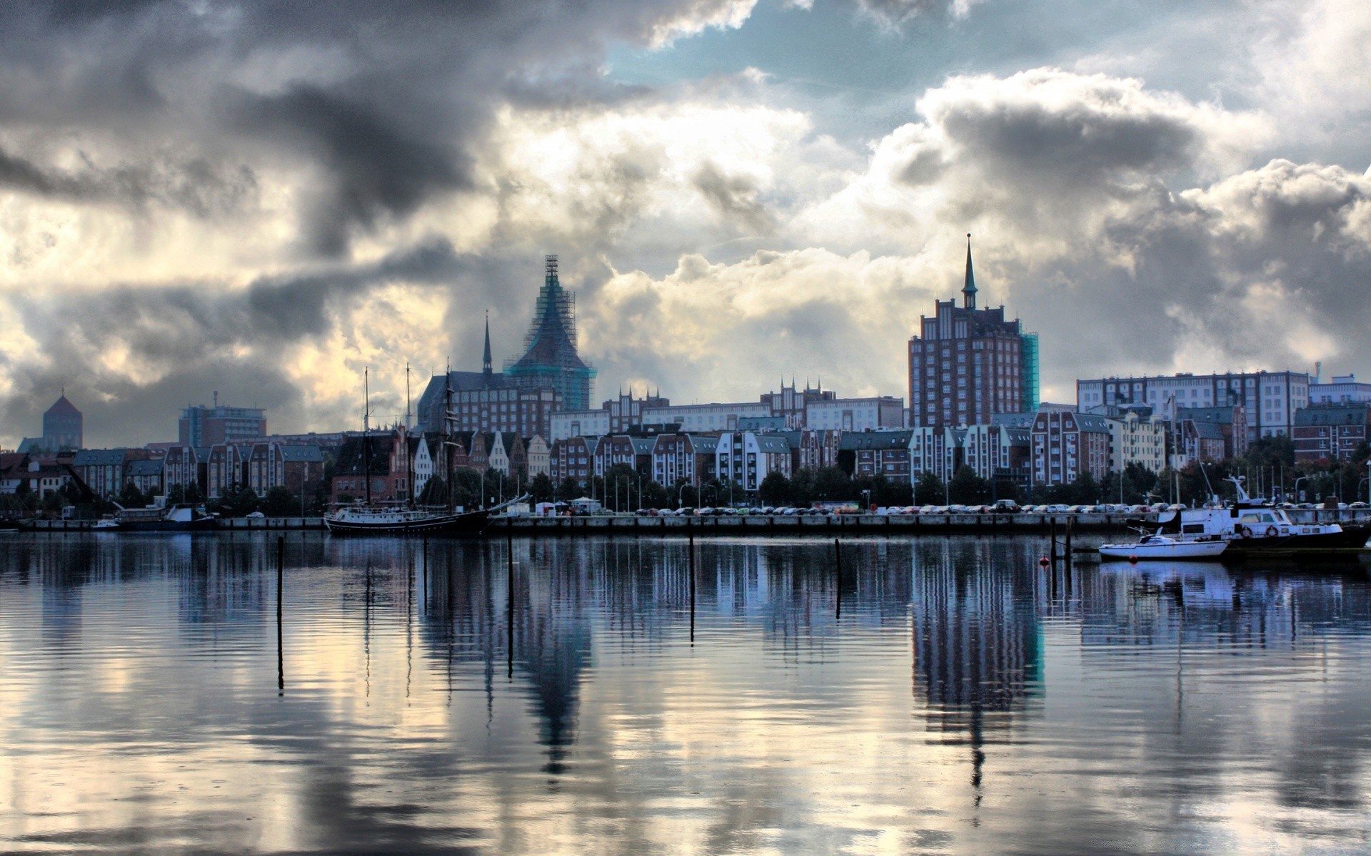 other city city river water reflection architecture skyline sunset sky travel cityscape building bridge pier urban waterfront dusk