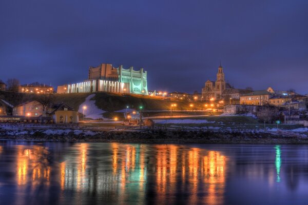 A city by the water, twilight and lights