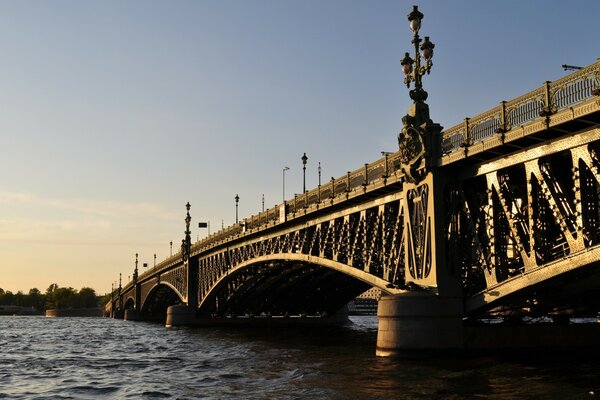 The bright sun illuminates the bridge