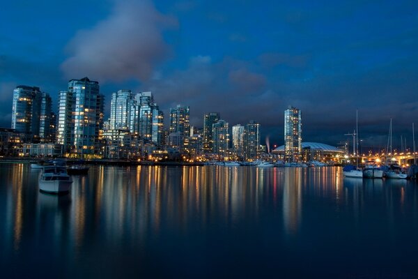 Reflection of the evening city in the river