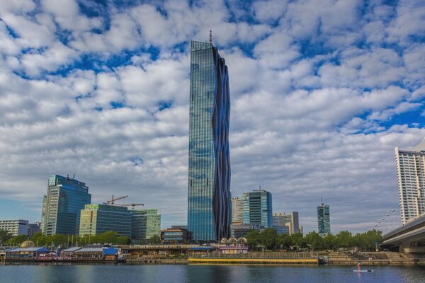 A majestically towering skyscraper on the shore