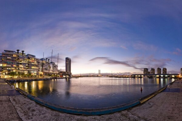 A city near the sea skyscrapers sky water