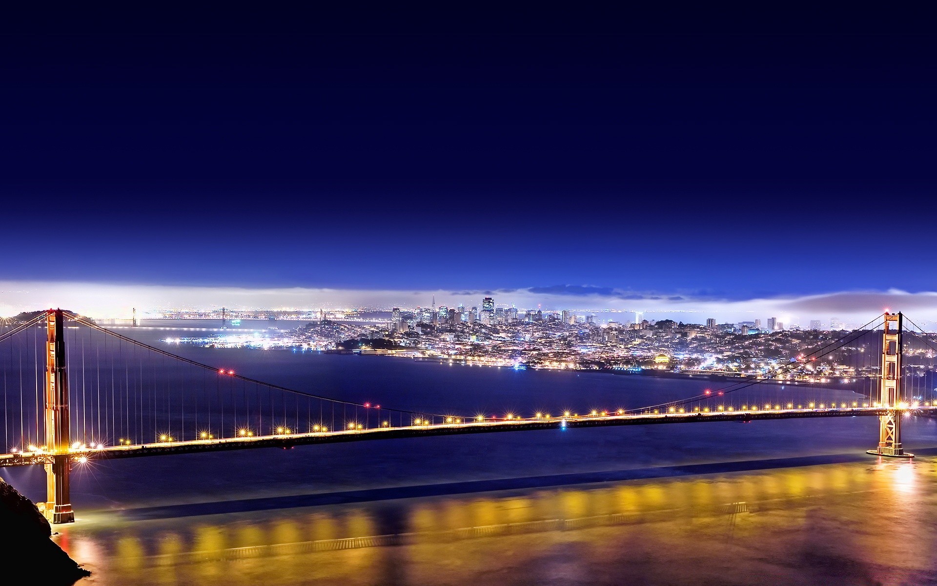 other city bridge water dusk travel architecture sunset city evening sky river transportation system suspension bridge cityscape reflection traffic light blur downtown moon