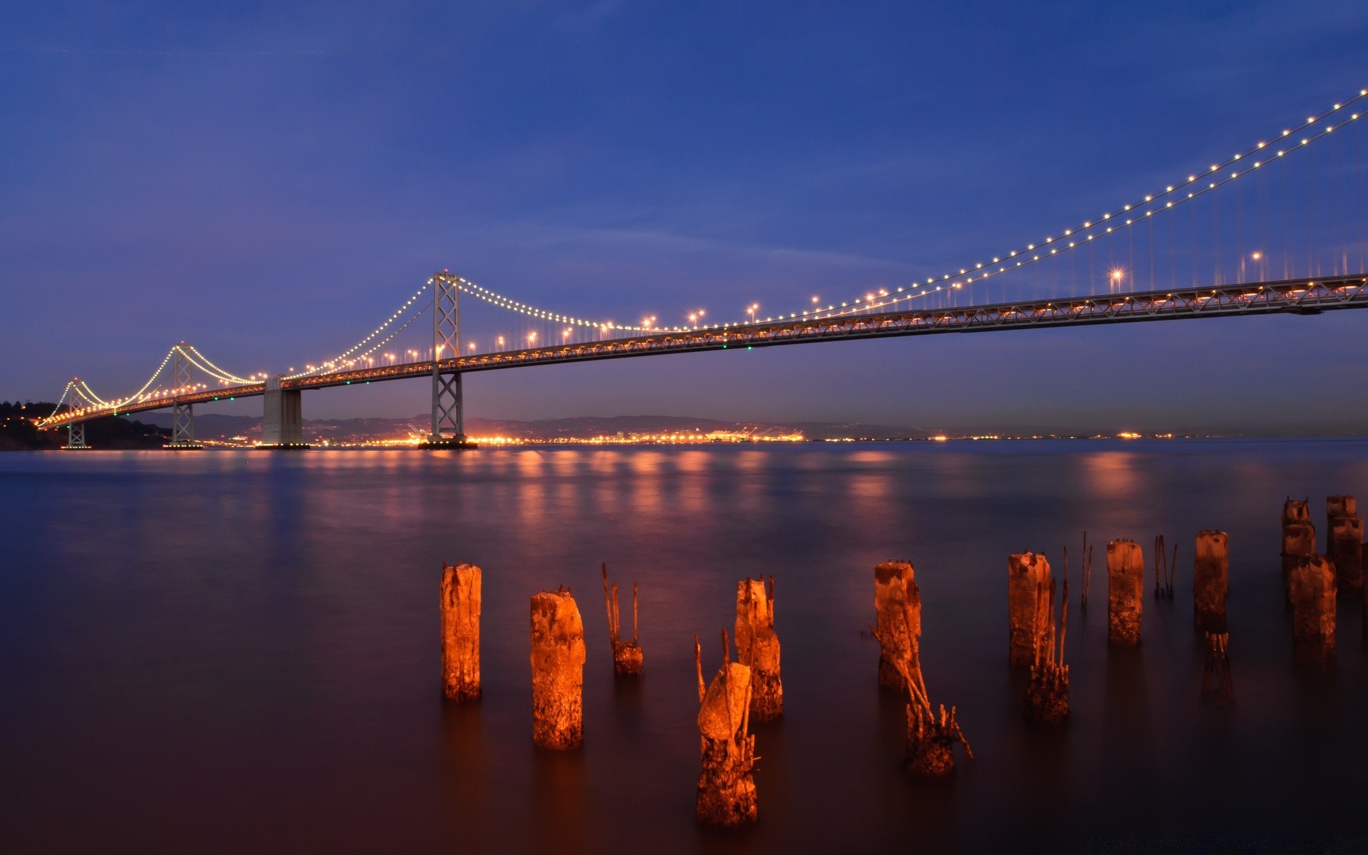 other city bridge suspension bridge water sunset evening river architecture travel dusk city suspension sky connection reflection transportation system dawn suspend