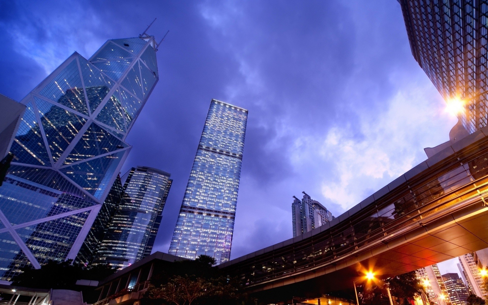 other city architecture city building sky light evening travel skyscraper dusk downtown urban bridge business cityscape modern road street tower construction