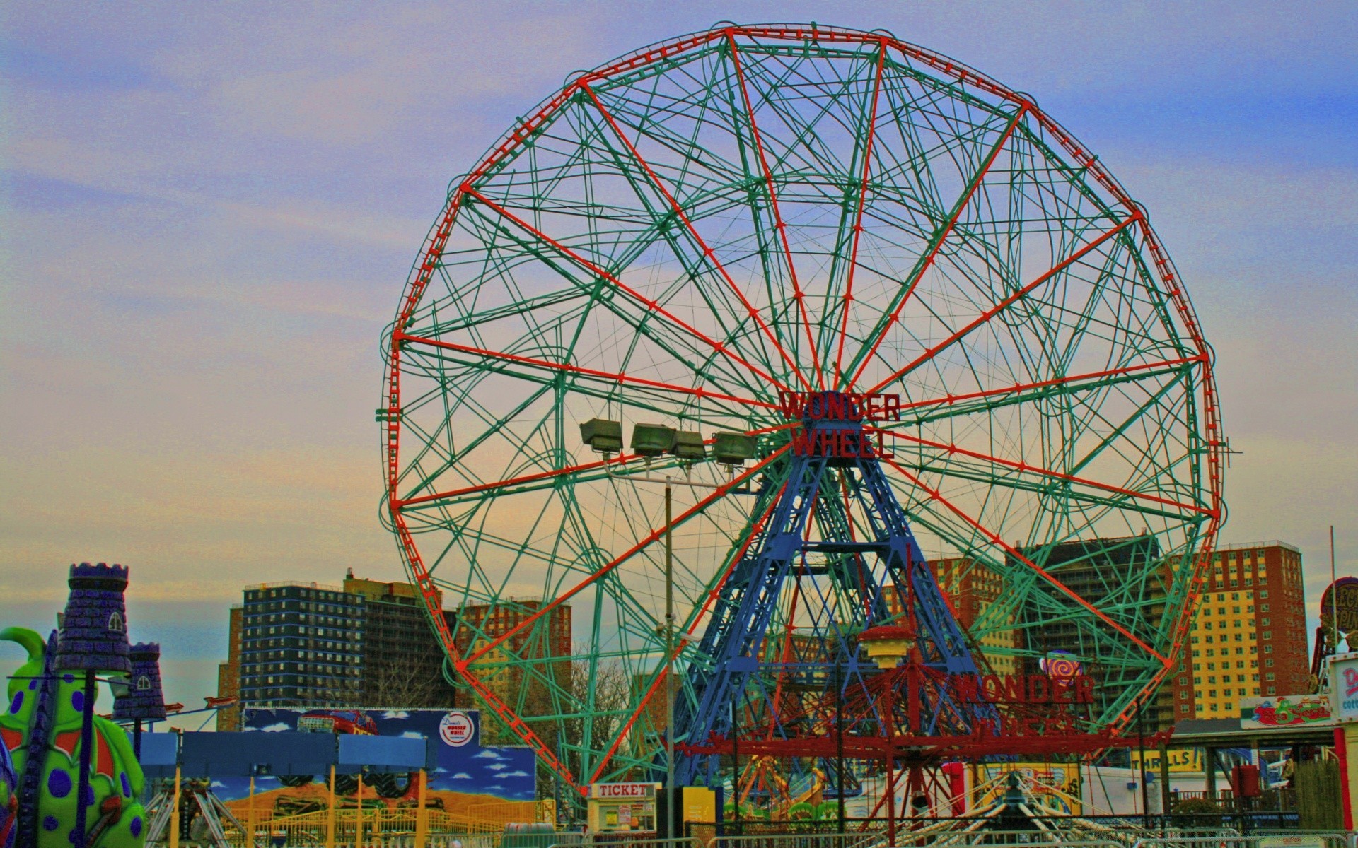 other city carnival carousel entertainment ferris wheel sky fairground festival circus wheel outdoors travel fun construction exhilaration big spin high architecture