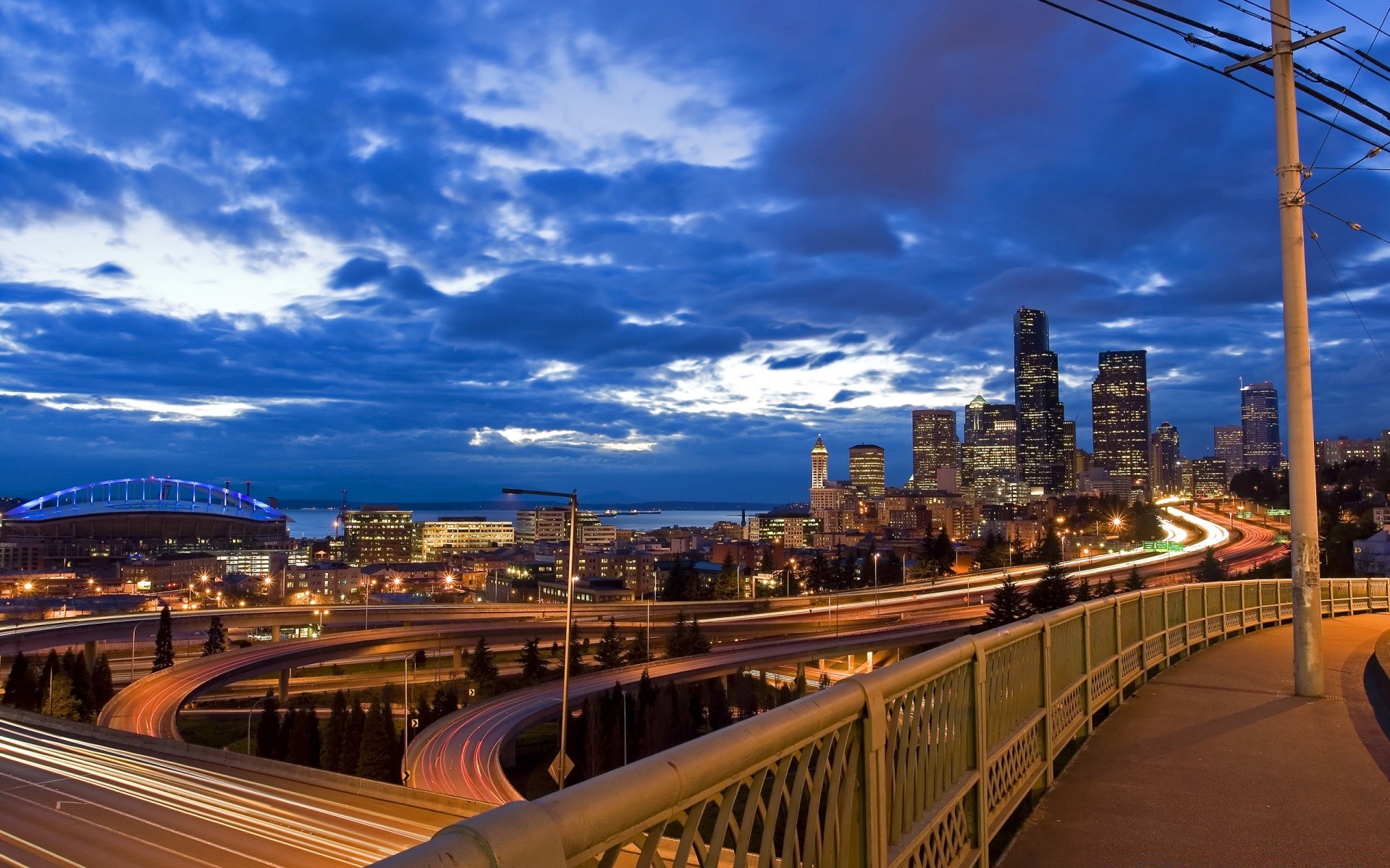 other city travel city dusk building bridge architecture cityscape downtown urban skyline sky evening transportation system road sunset traffic highway skyscraper modern street