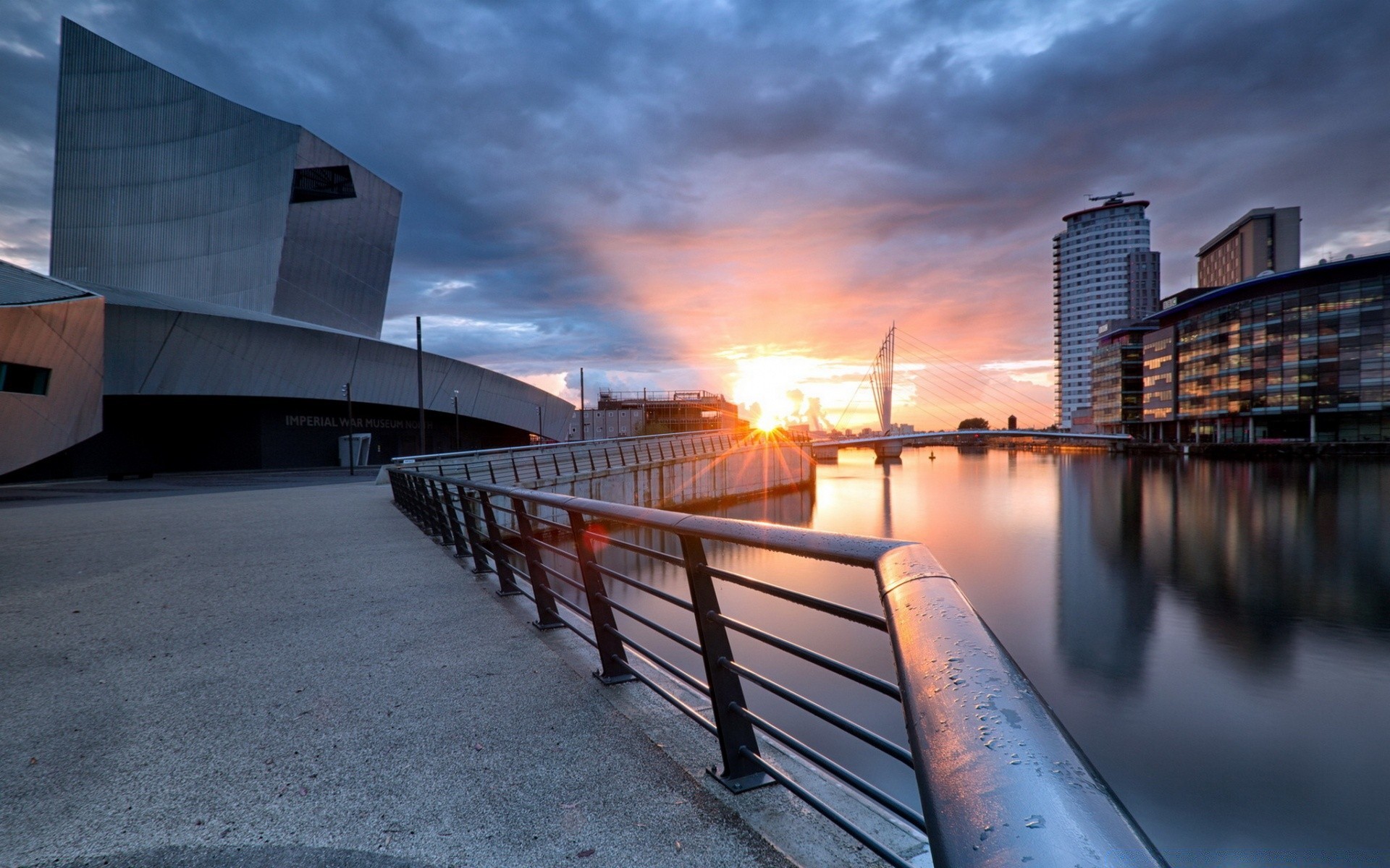 other city sunset water architecture bridge city sky dawn travel building reflection light dusk pier modern urban outdoors sun sea