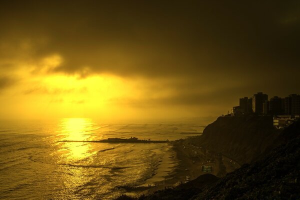 A city on a rock with sunlight